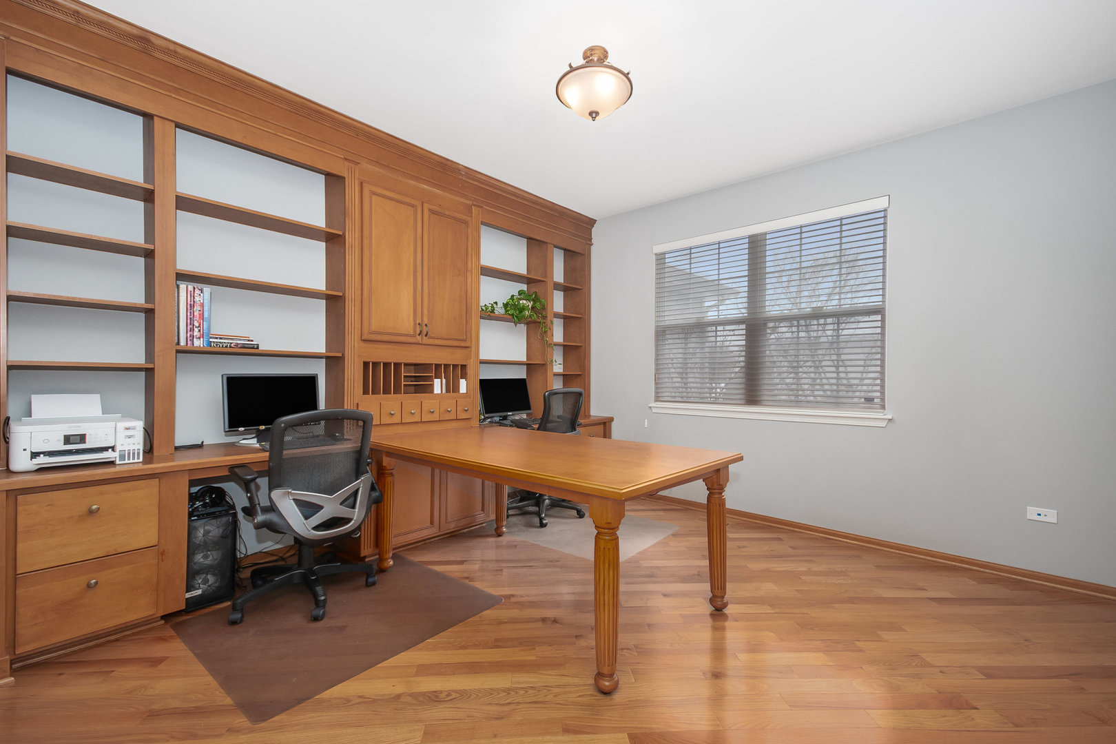 712 Eagle Brook Lane Naperville, IL 60565 - Photo 15 of 40 a view of a workspace with furniture and a window
