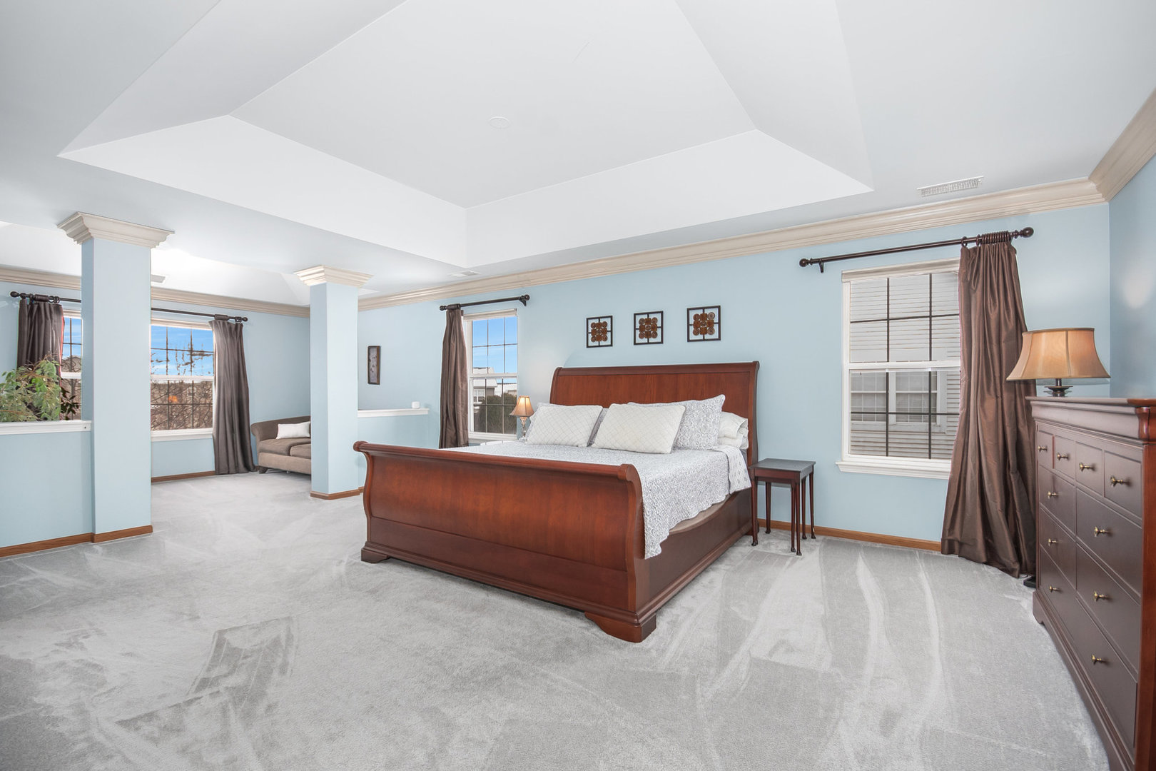 712 Eagle Brook Lane Naperville, IL 60565 - Photo 18 of 40 a spacious bedroom with a bed and a refrigerator