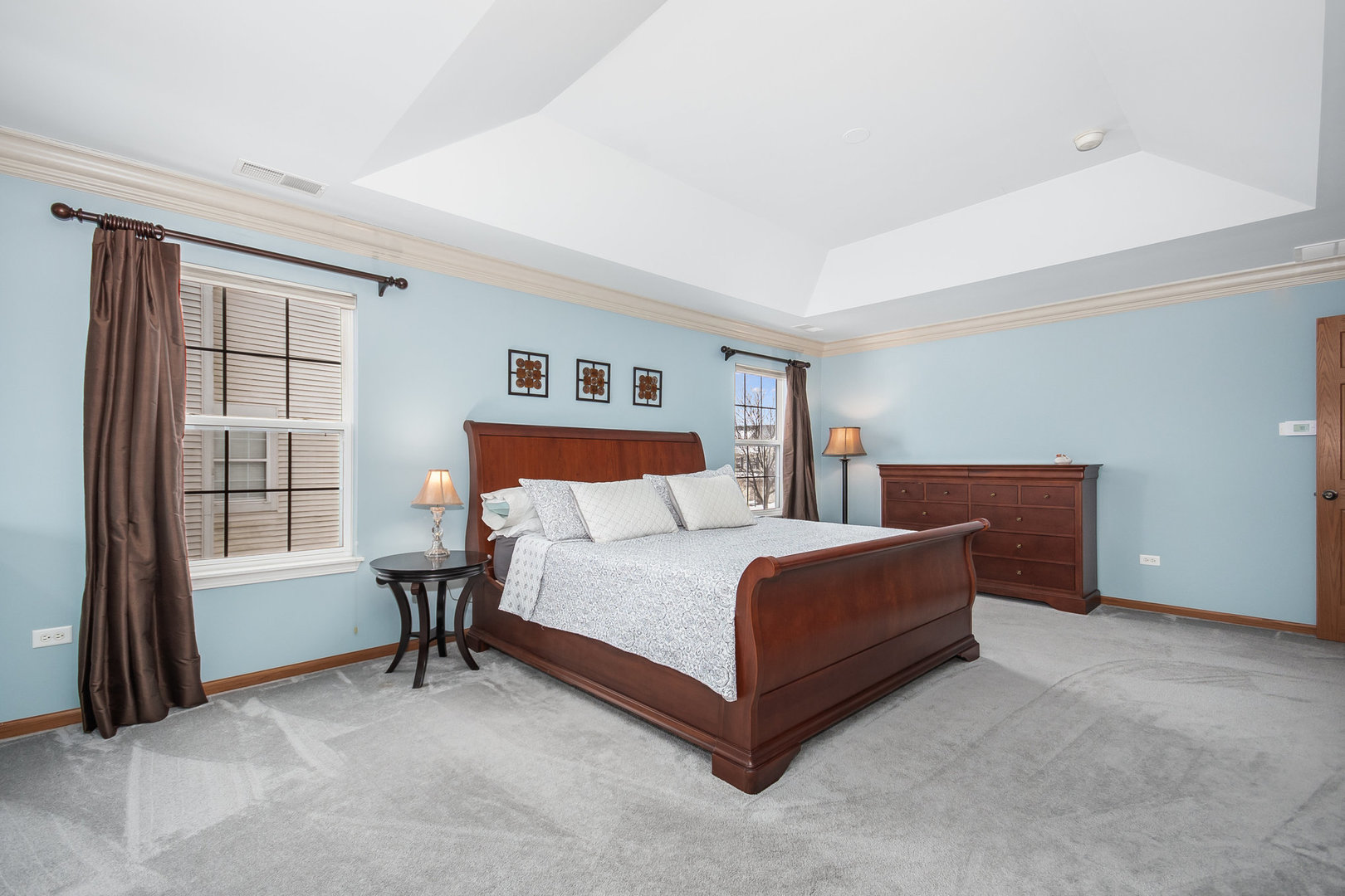 712 Eagle Brook Lane Naperville, IL 60565 - Photo 20 of 40 a bedroom with a bed lamp and window