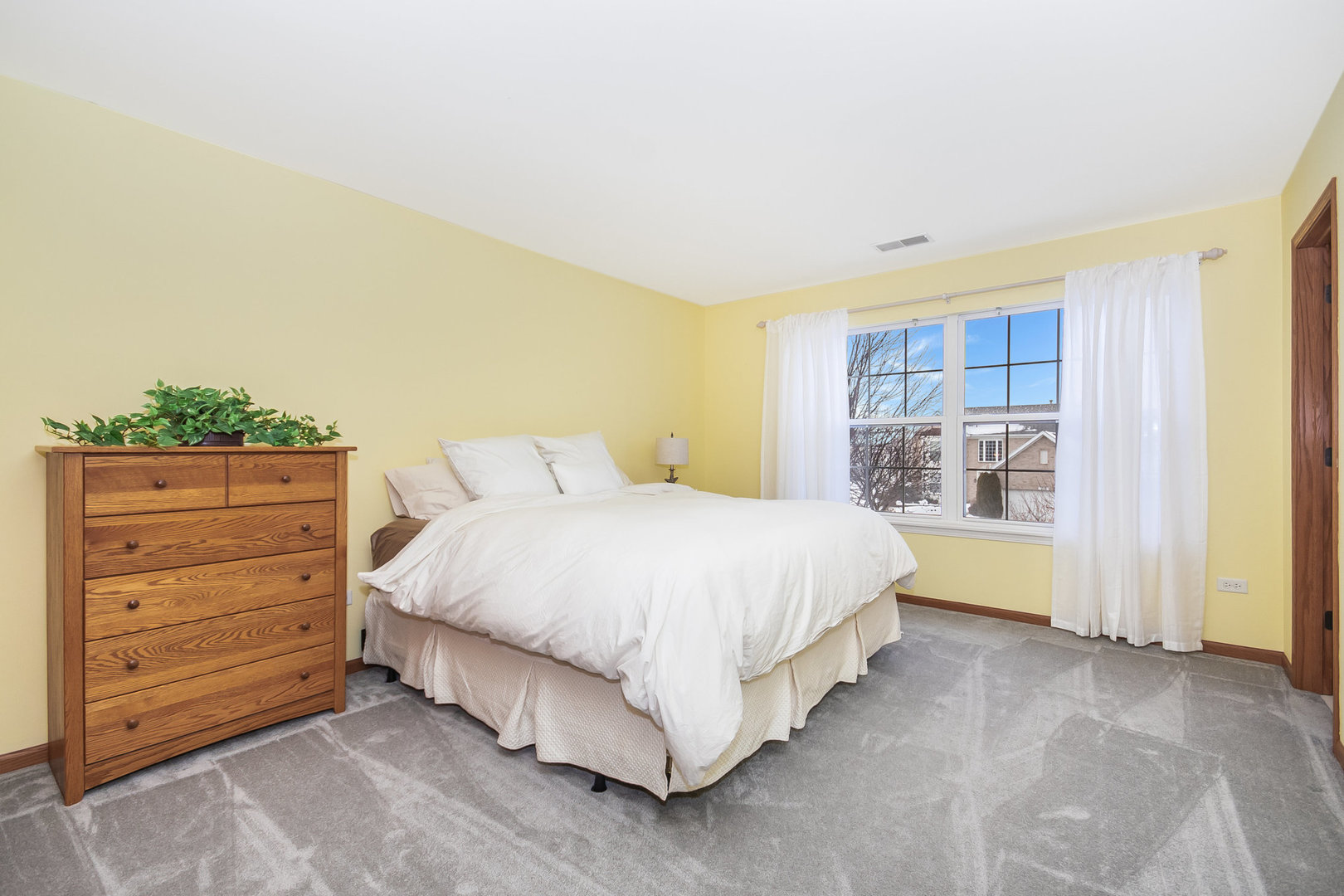 712 Eagle Brook Lane Naperville, IL 60565 - Photo 23 of 40 a spacious bedroom with a bed and a window
