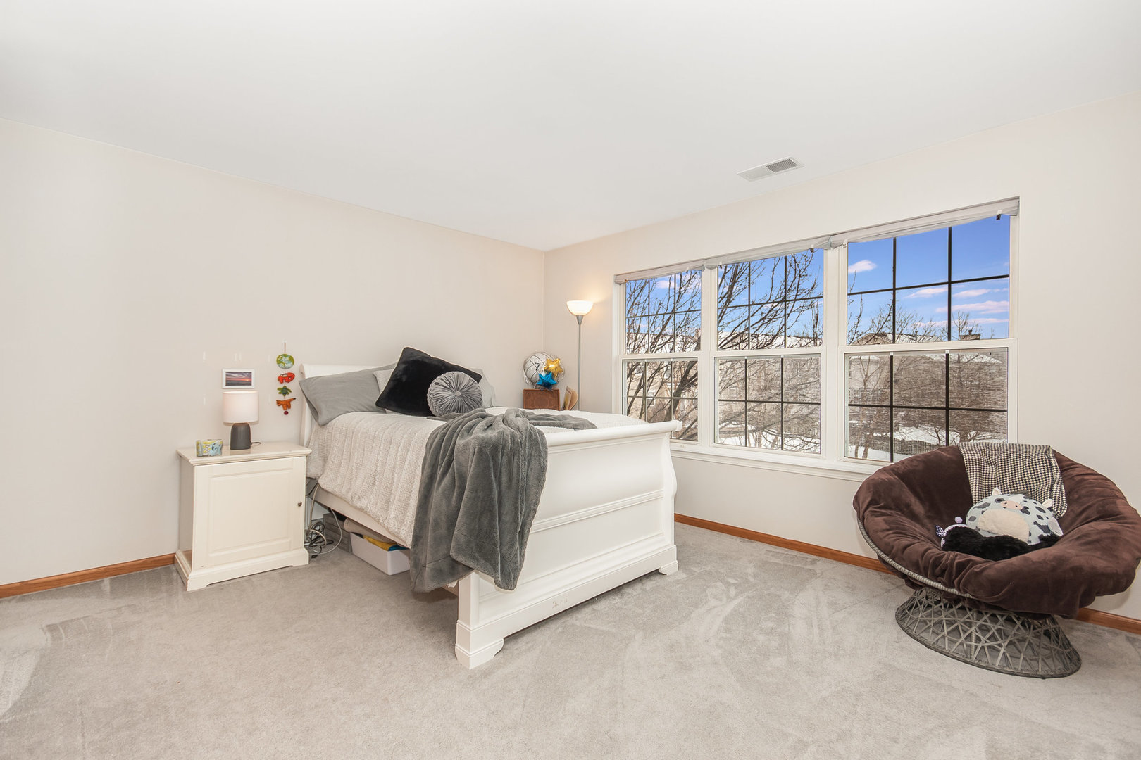 712 Eagle Brook Lane Naperville, IL 60565 - Photo 26 of 40 a living room with furniture and a large window