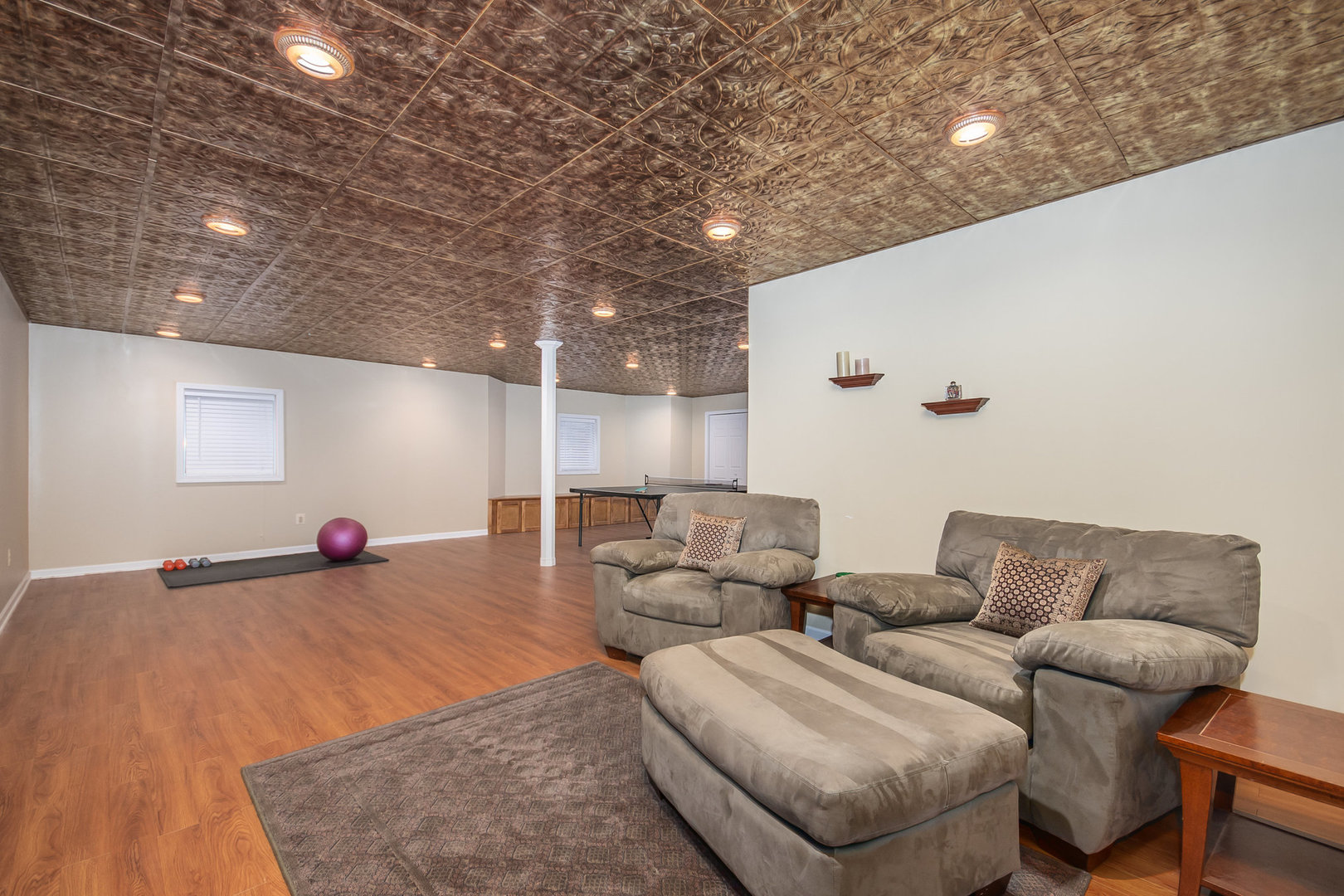 712 Eagle Brook Lane Naperville, IL 60565 - Photo 32 of 40 a living room with furniture and a wooden floor