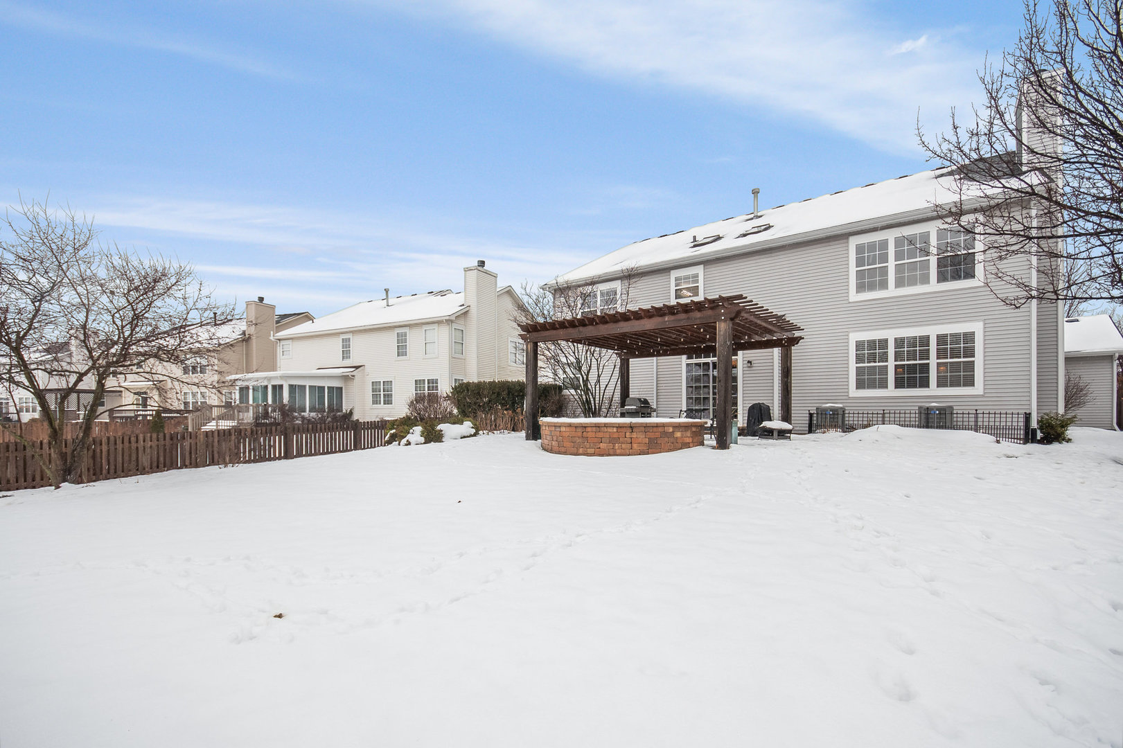 712 Eagle Brook Lane Naperville, IL 60565 - Photo 35 of 40 a wooden bench sitting in front of a building