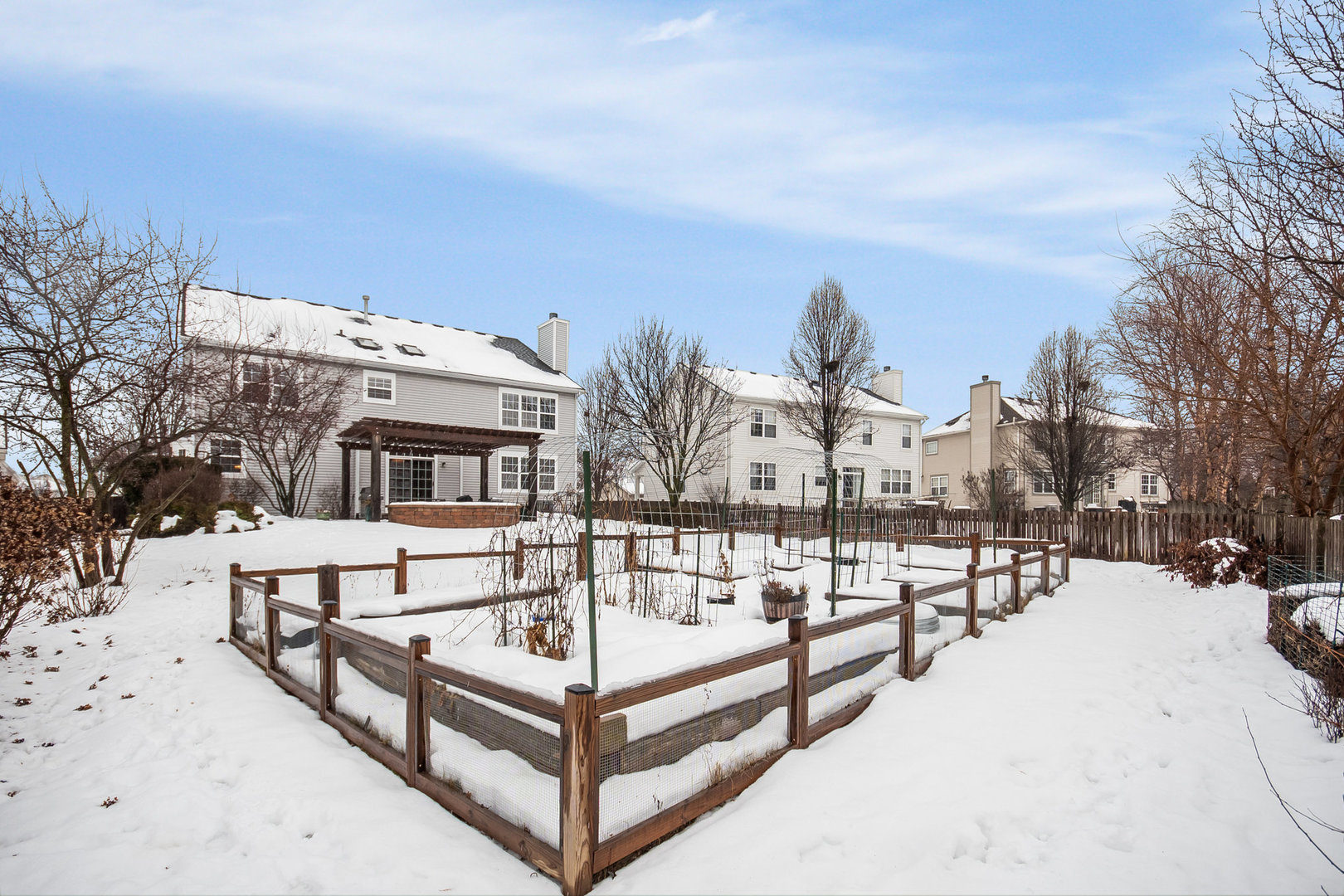712 Eagle Brook Lane Naperville, IL 60565 - Photo 36 of 40 a view of a house with snow on the roof deck