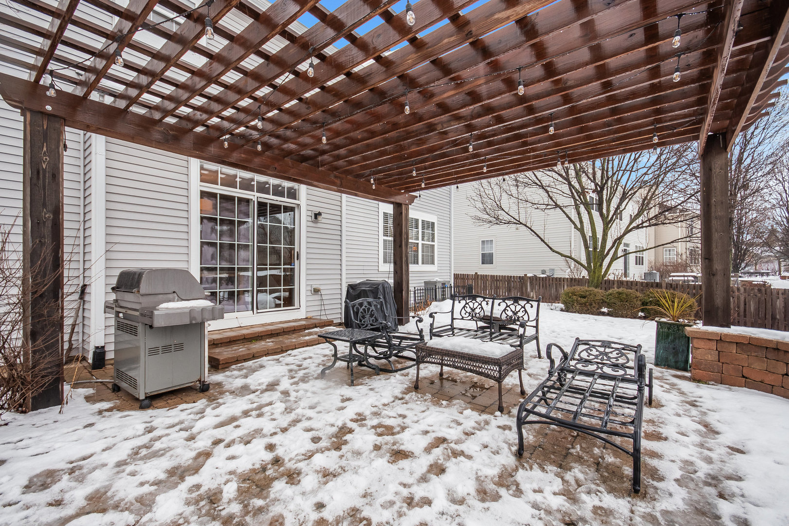 712 Eagle Brook Lane Naperville, IL 60565 - Photo 38 of 40 a outdoor living space with furniture and a fireplace