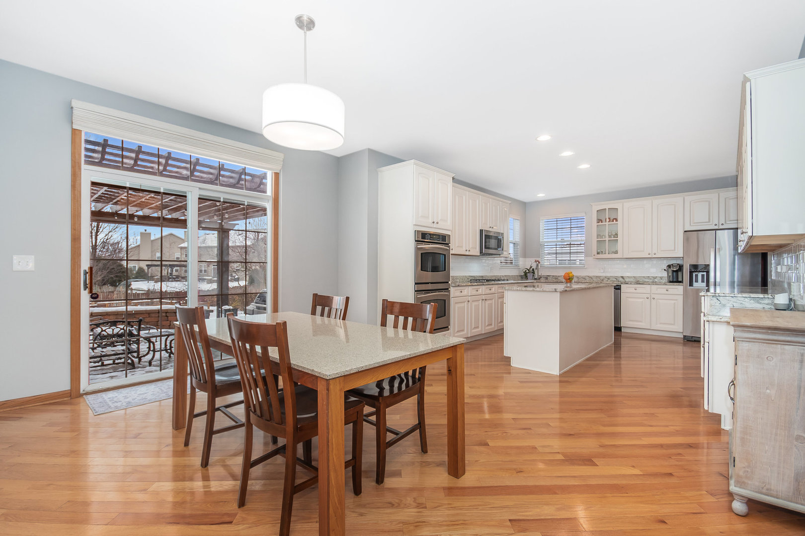 712 Eagle Brook Lane Naperville, IL 60565 - Photo 6 of 40 a view of a dining room with furniture window and wooden floor