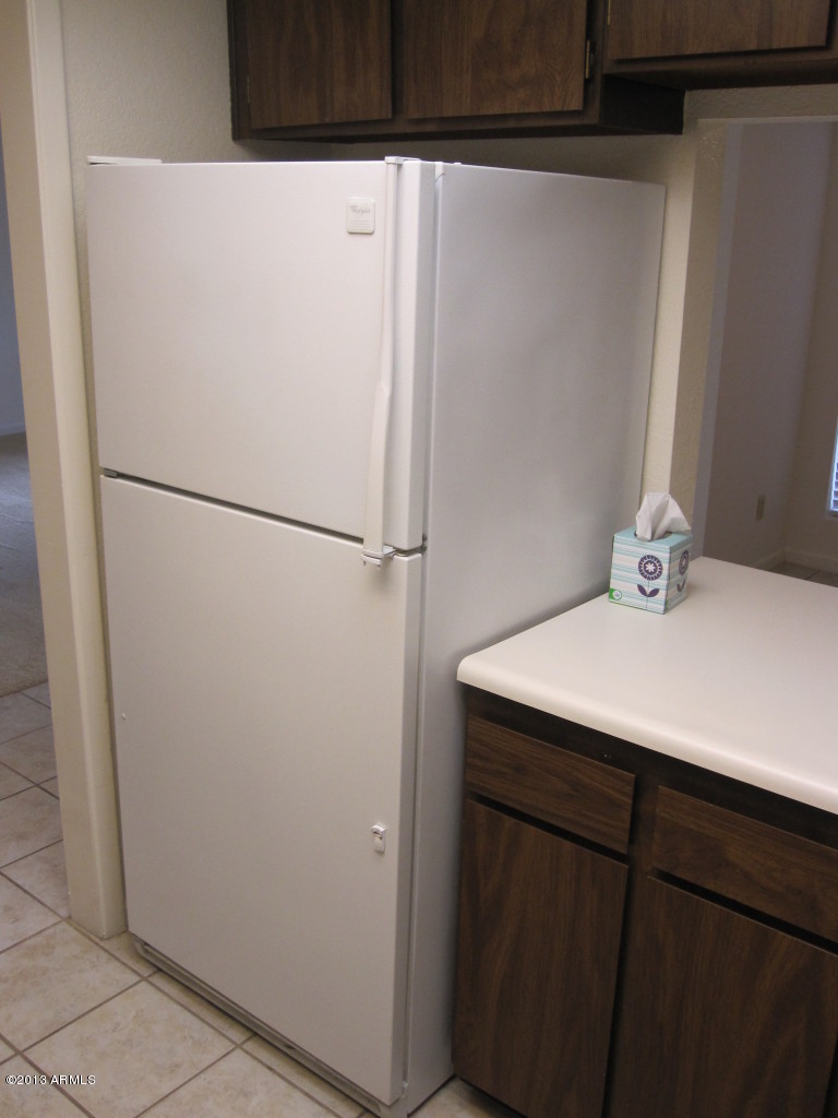 202 East Ruth Avenue, Unit 4 Phoenix, AZ 85020 - Photo 5 of 13 Refrigerator with surrounding cabs