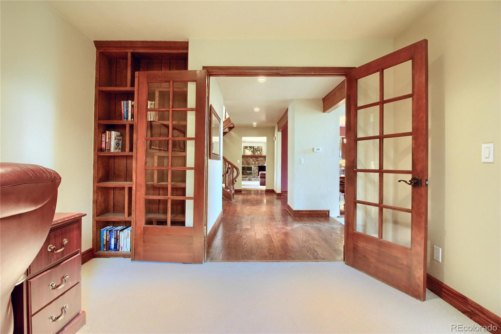 5661 West Lakeridge Road Lakewood, CO 80227 - Photo 14 of 35 a view of livingroom with furniture and wooden floor