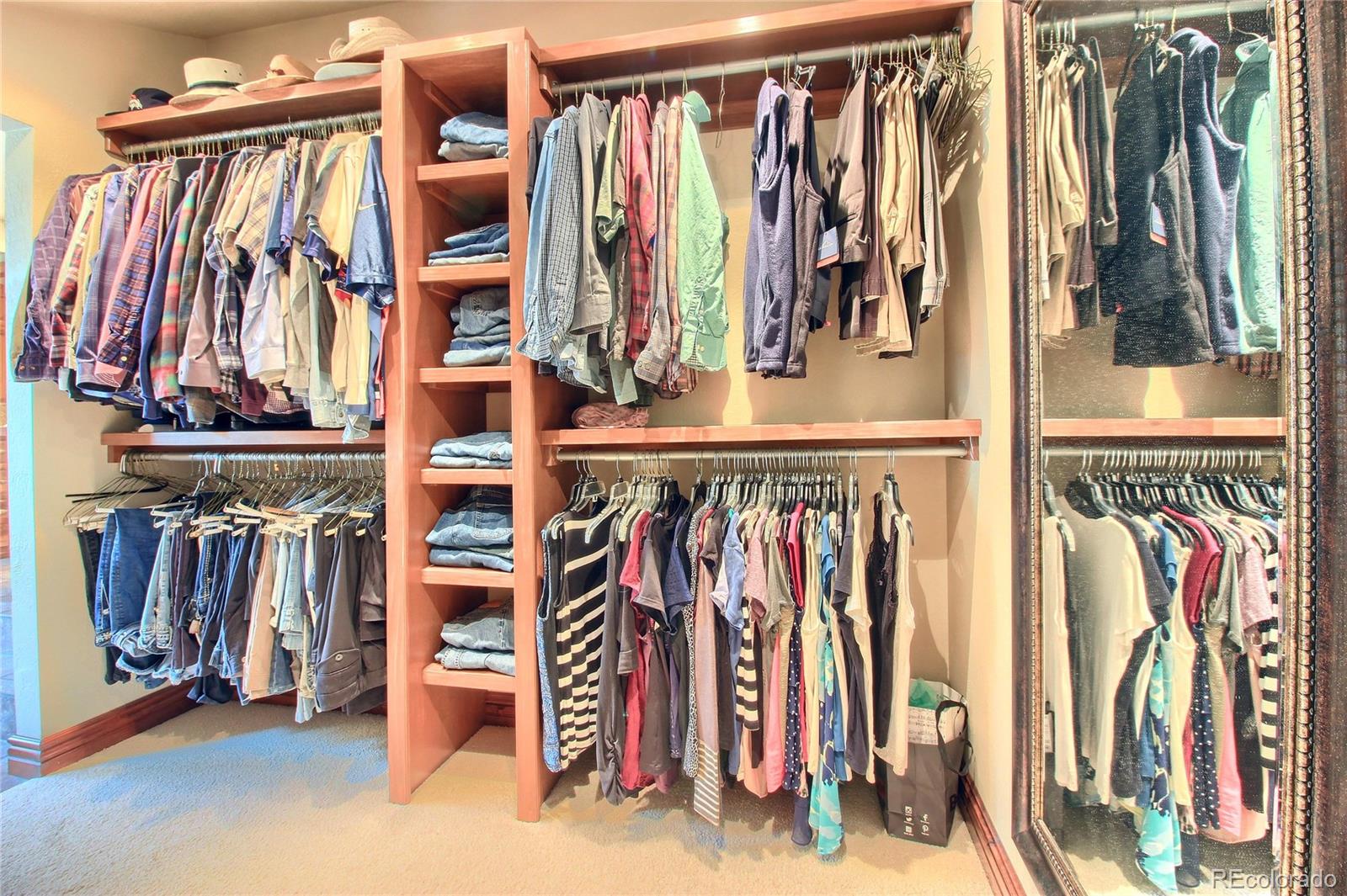 5661 West Lakeridge Road Lakewood, CO 80227 - Photo 22 of 35 a view of walk in closet with clothes