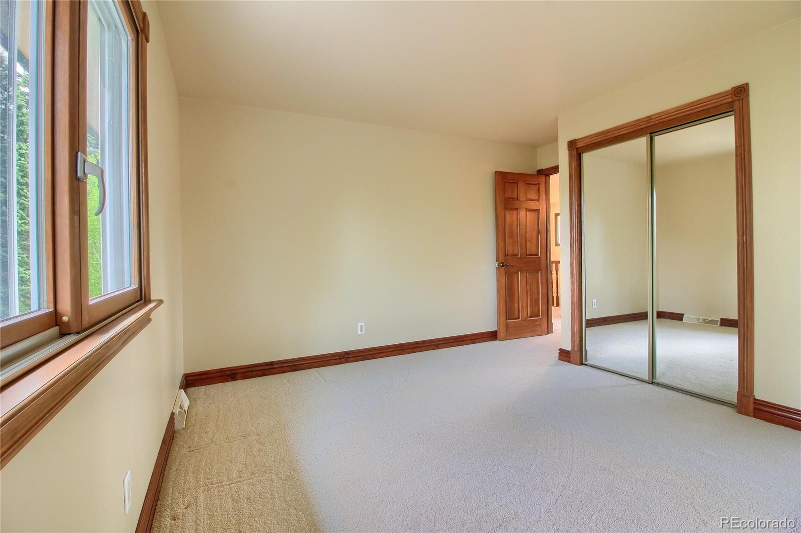 5661 West Lakeridge Road Lakewood, CO 80227 - Photo 24 of 35 a view of an empty room with a window