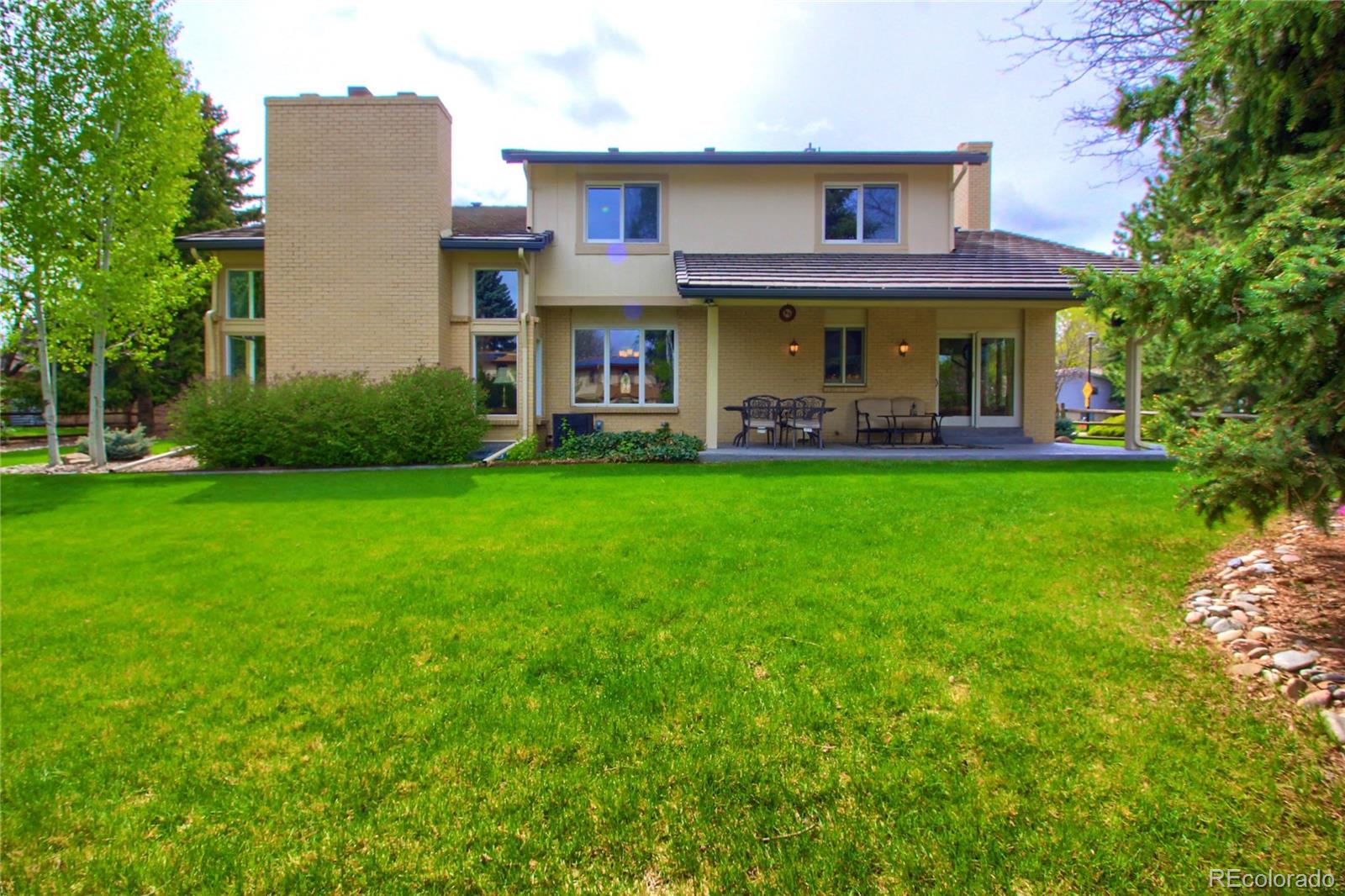 5661 West Lakeridge Road Lakewood, CO 80227 - Photo 29 of 35 a view of a building with a yard