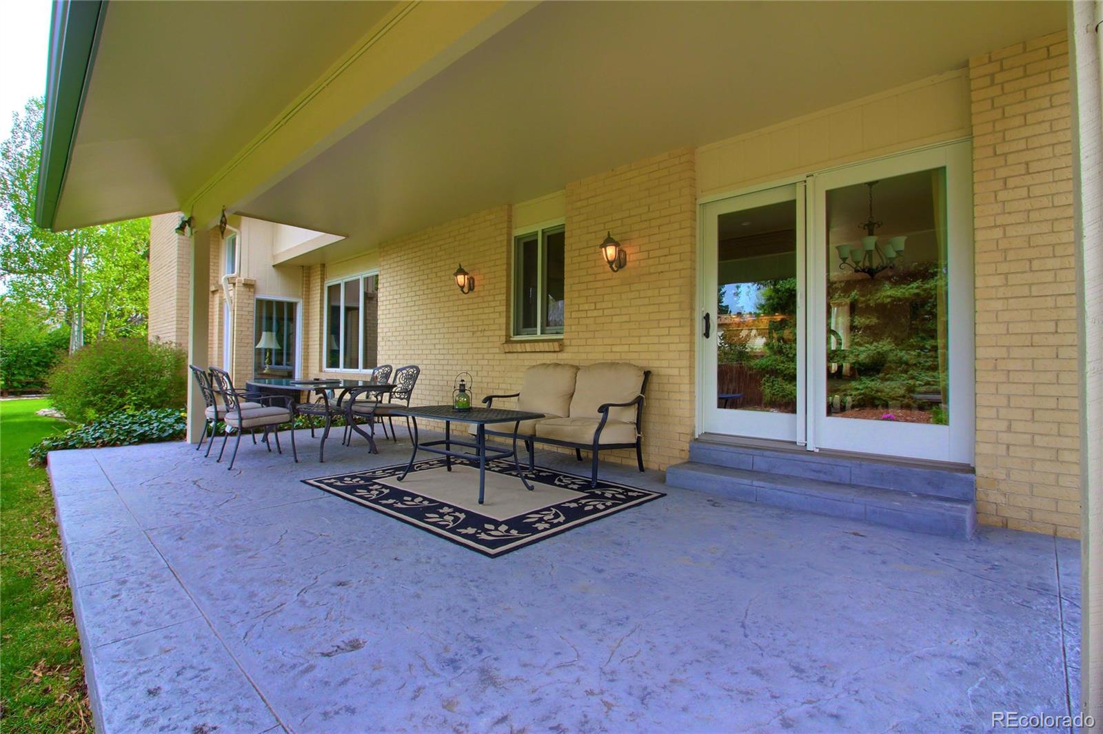 5661 West Lakeridge Road Lakewood, CO 80227 - Photo 31 of 35 a building outdoor space with patio furniture and potted plants