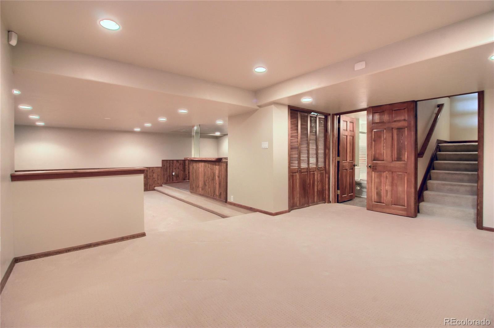 5661 West Lakeridge Road Lakewood, CO 80227 - Photo 33 of 35 a view of an empty room with stairs
