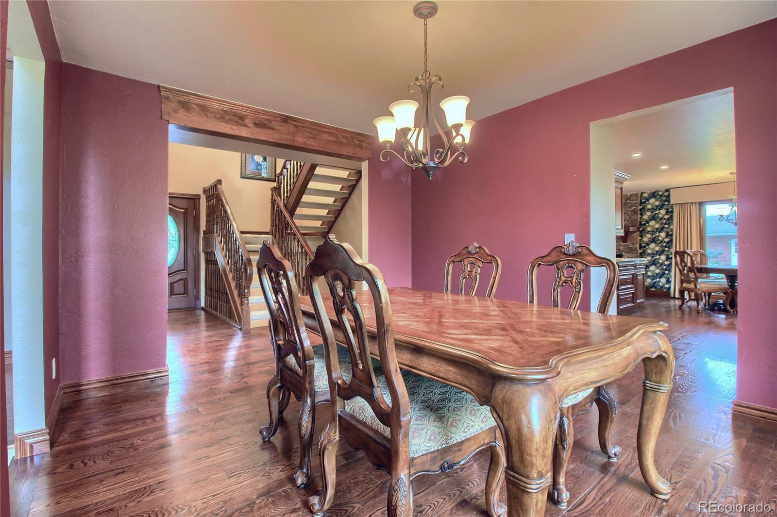 5661 West Lakeridge Road Lakewood, CO 80227 - Photo 7 of 35 a view of a dining room with furniture window and wooden floor