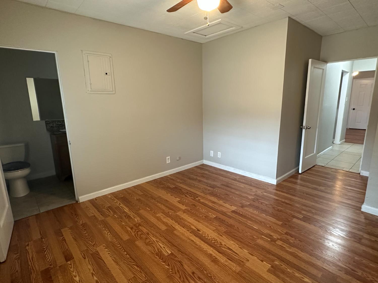 1235 N Street Newman, CA 95360 - Photo 11 of 33 a view of a room with wooden floor and a sink