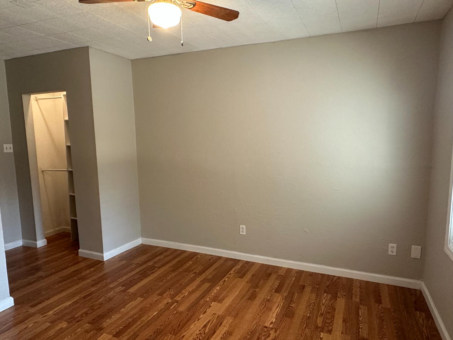 1235 N Street Newman, CA 95360 - Photo 13 of 33 wooden floor in an empty room