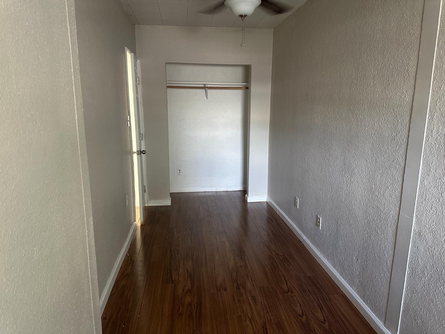 1235 N Street Newman, CA 95360 - Photo 23 of 33 a view of hallway with wooden floor