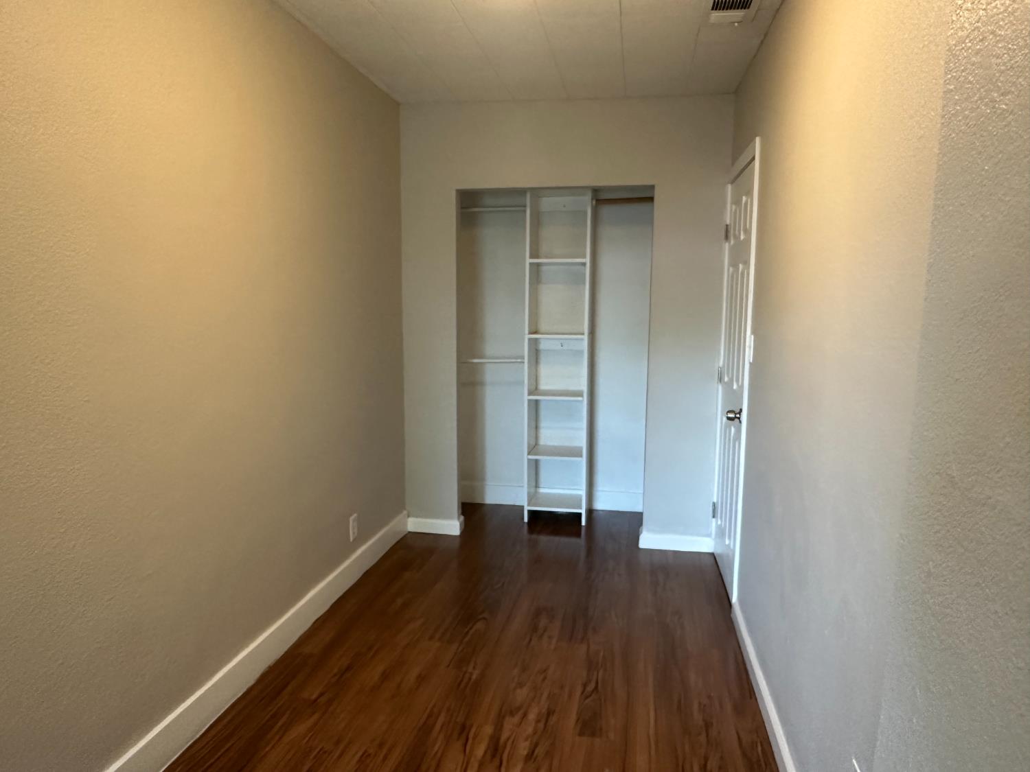 1235 N Street Newman, CA 95360 - Photo 6 of 33 a view of a room with wooden floor and a window