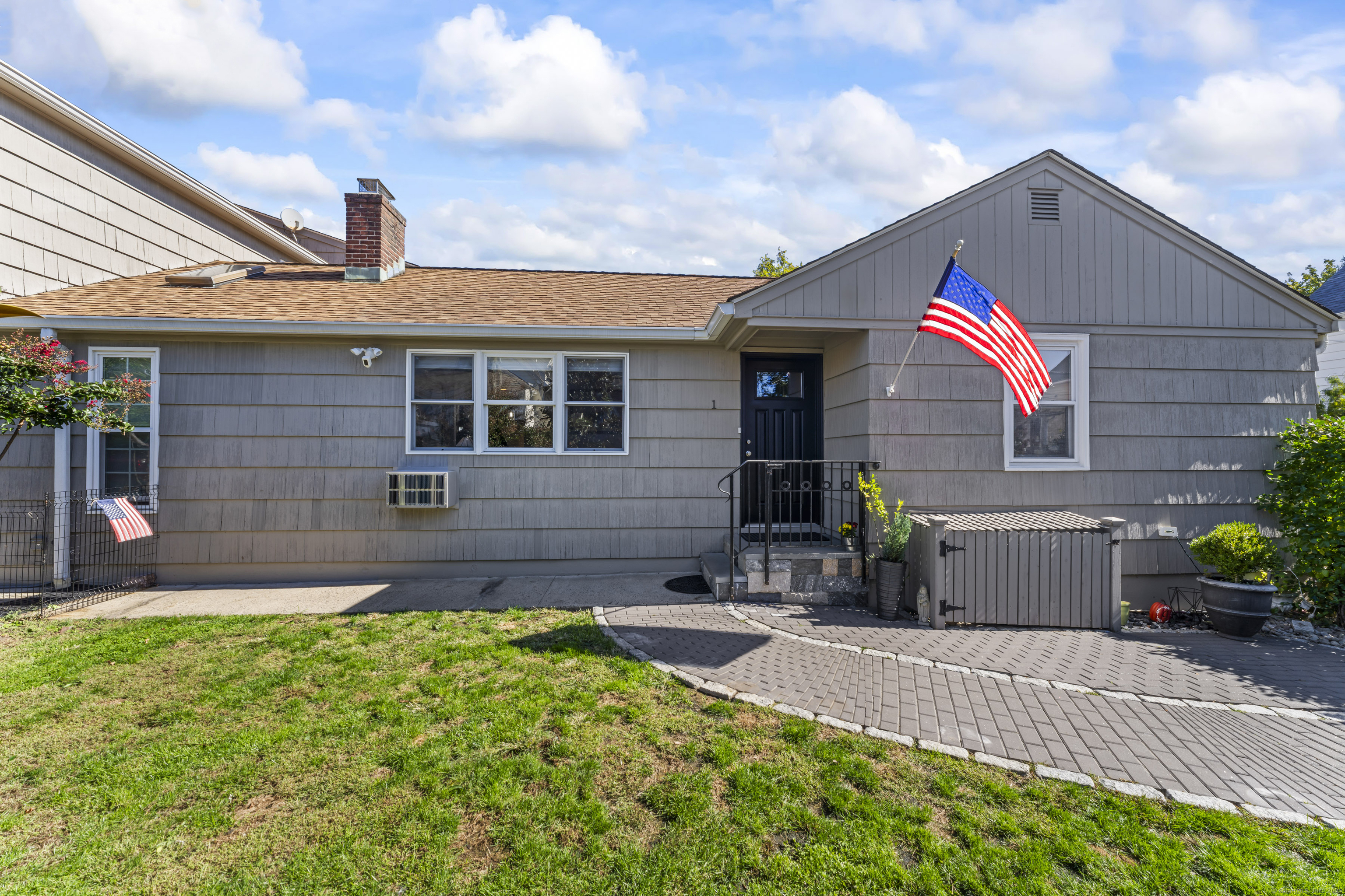 88 Dean Street, Unit 1 Stamford, CT 06902 - Photo 1 of 1 a front view of a house with a yard