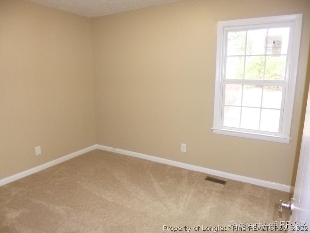5135 Murphy Road Stedman, NC 28391 - Photo 18 of 33 an empty room with a window