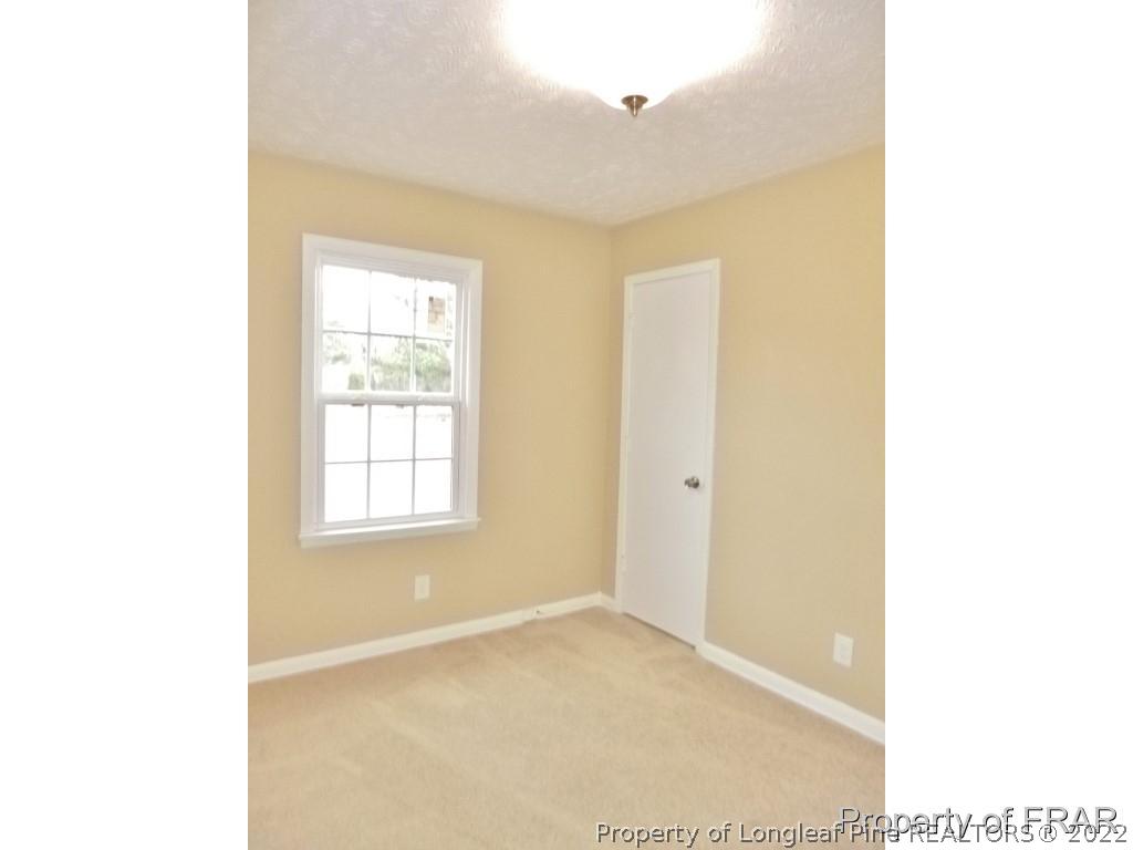 5135 Murphy Road Stedman, NC 28391 - Photo 20 of 33 a view of an empty room with a window