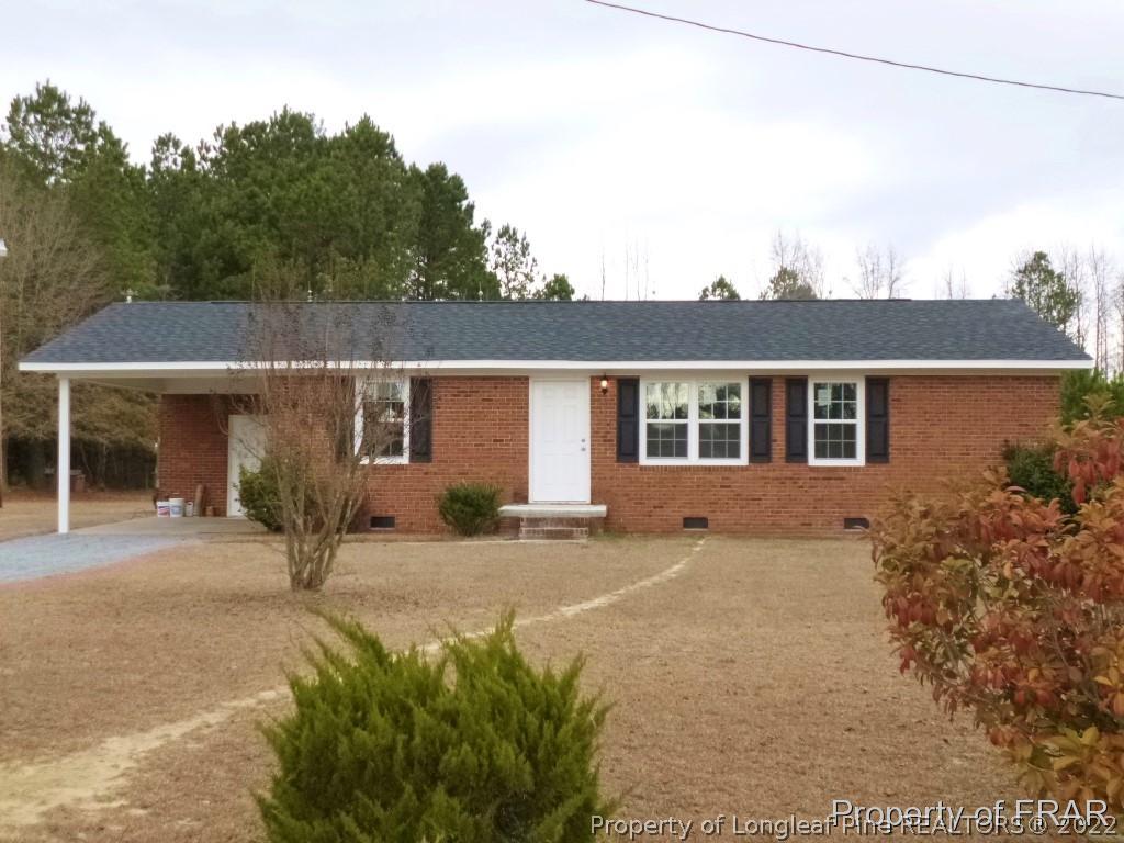 5135 Murphy Road Stedman, NC 28391 - Photo 2 of 33 front view of a house with a outdoor space