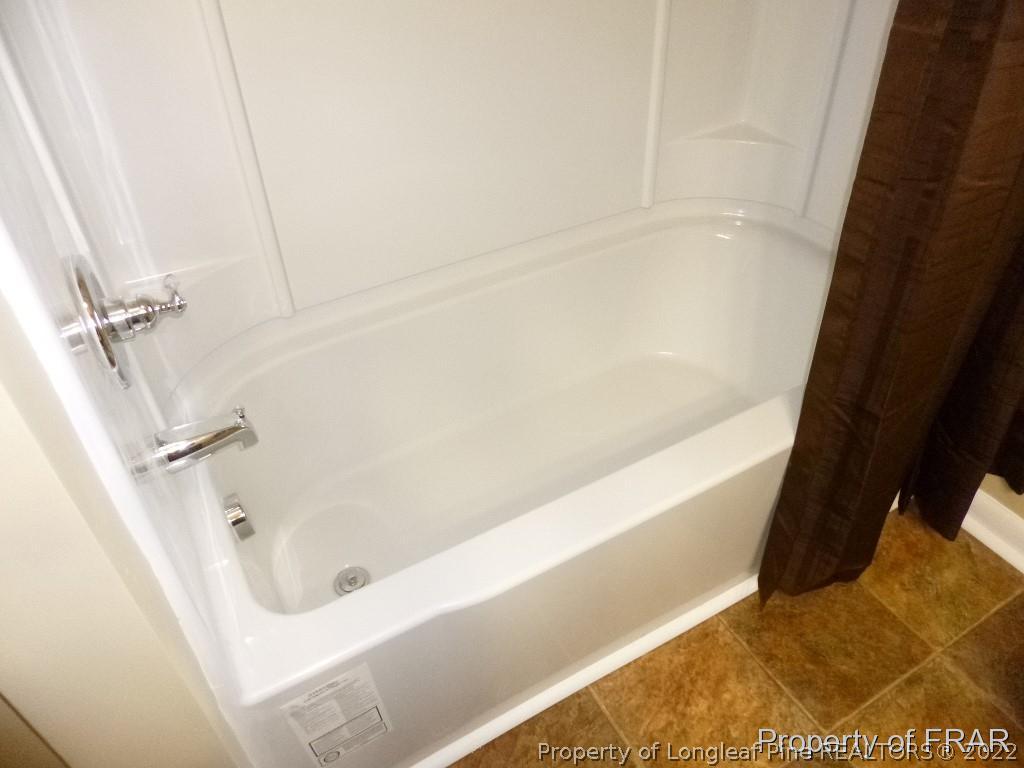 5135 Murphy Road Stedman, NC 28391 - Photo 27 of 33 a bathroom with a bathtub
