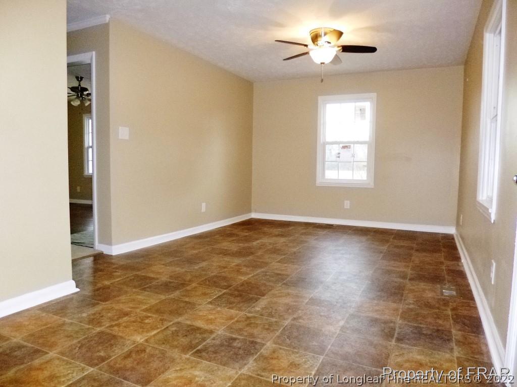 5135 Murphy Road Stedman, NC 28391 - Photo 8 of 33 wooden floor in an empty room with a window