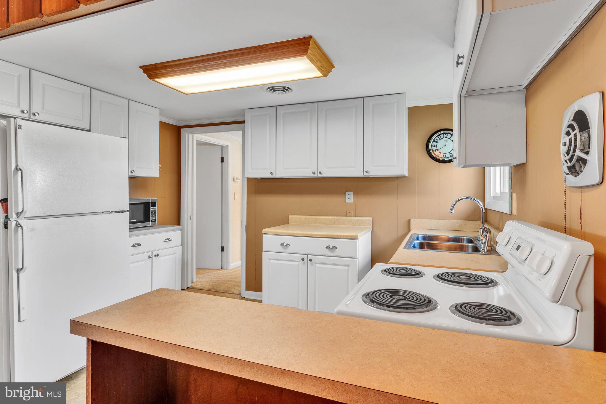 305 Colieville Lane Reedville, VA 22539 - Photo 11 of 49 Bright and inviting kitchen space.