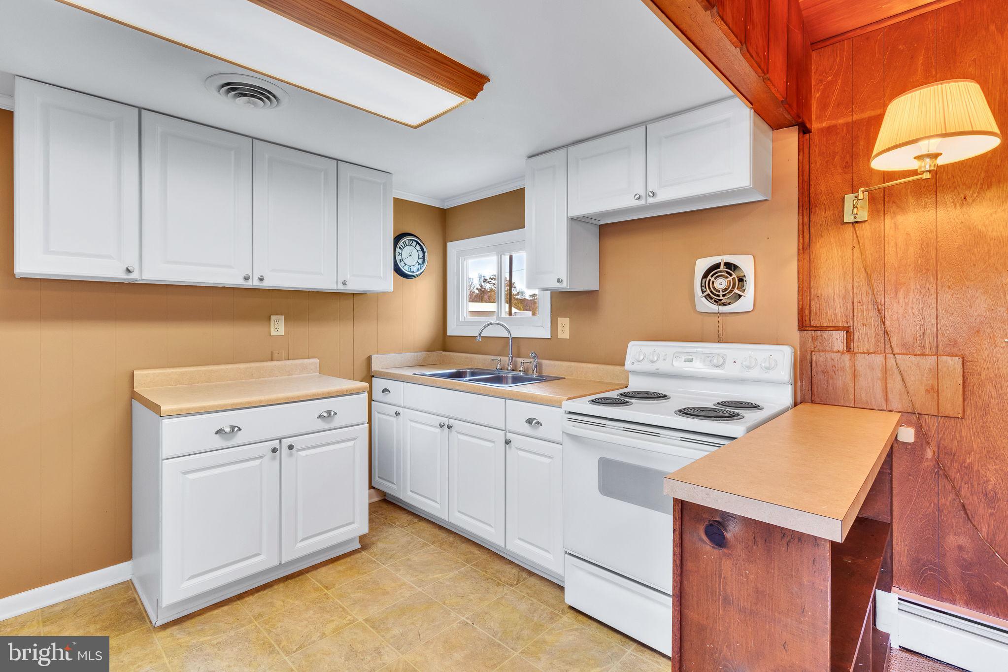 305 Colieville Lane Reedville, VA 22539 - Photo 12 of 49 Charming kitchen with modern touches.