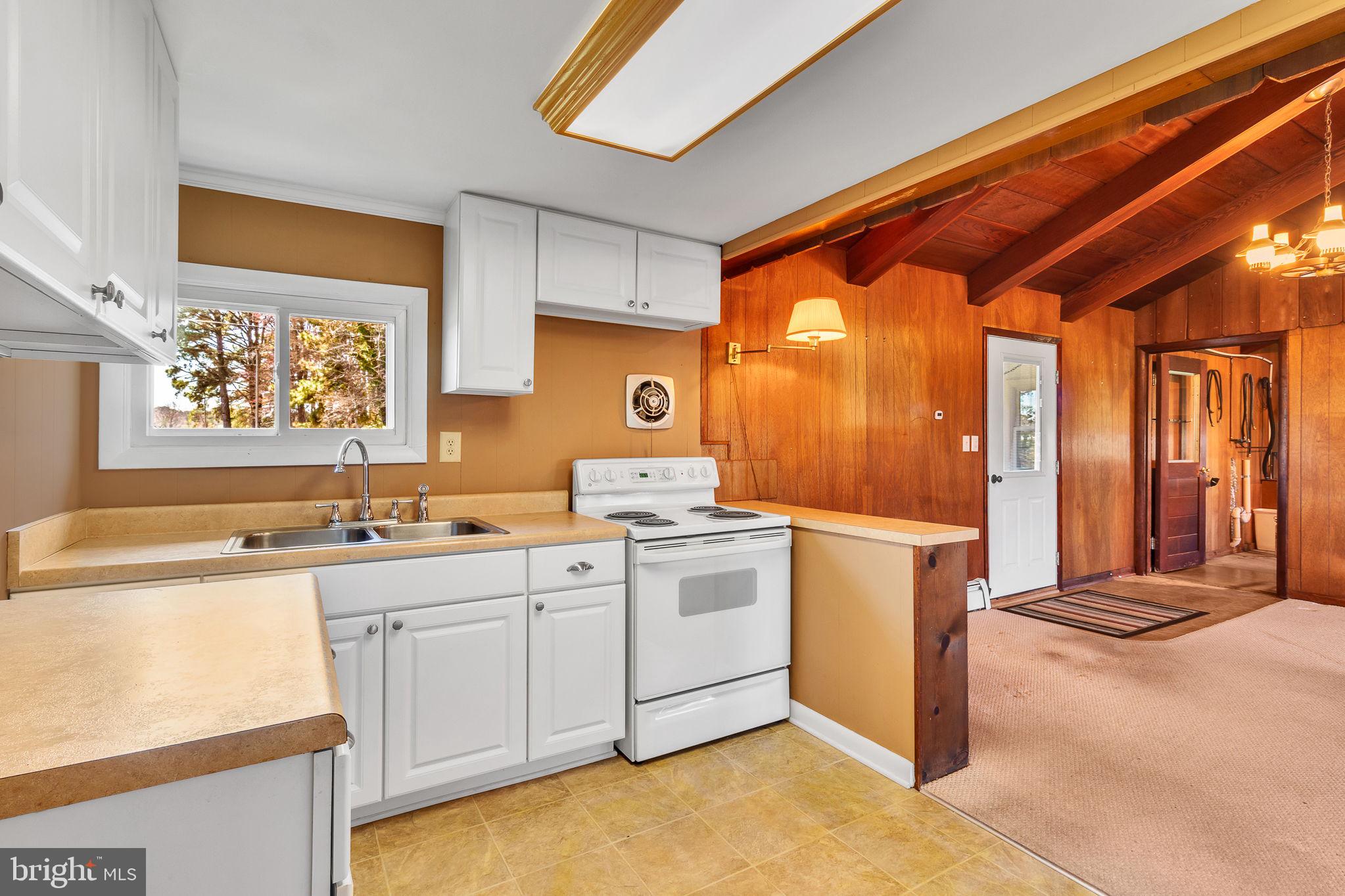 305 Colieville Lane Reedville, VA 22539 - Photo 13 of 49 Charming kitchen with rustic warmth.