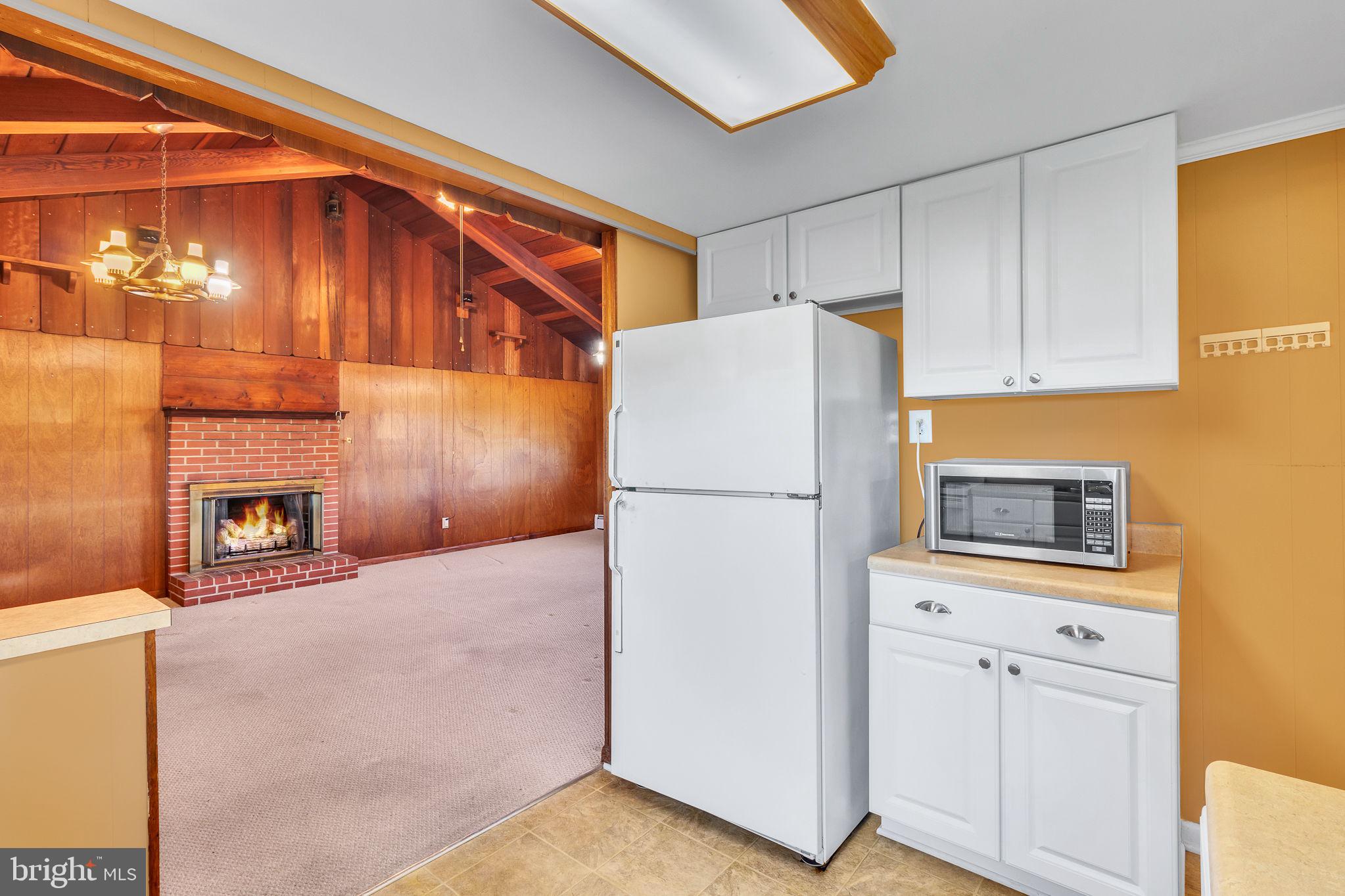 305 Colieville Lane Reedville, VA 22539 - Photo 14 of 49 Cozy kitchen with inviting living space.