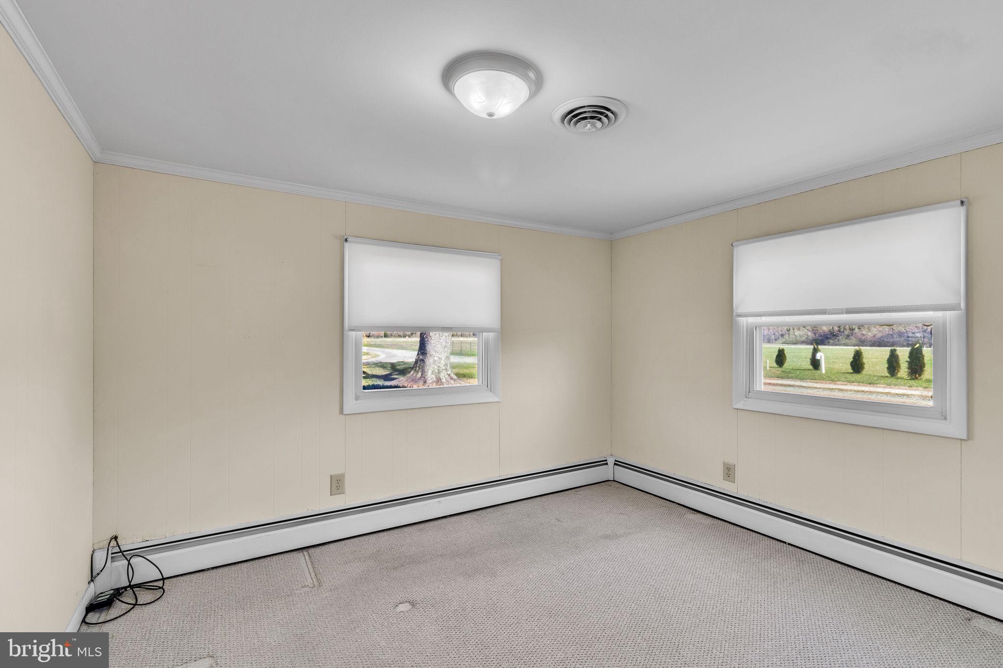 305 Colieville Lane Reedville, VA 22539 - Photo 16 of 49 Bright and airy corner room awaits you.