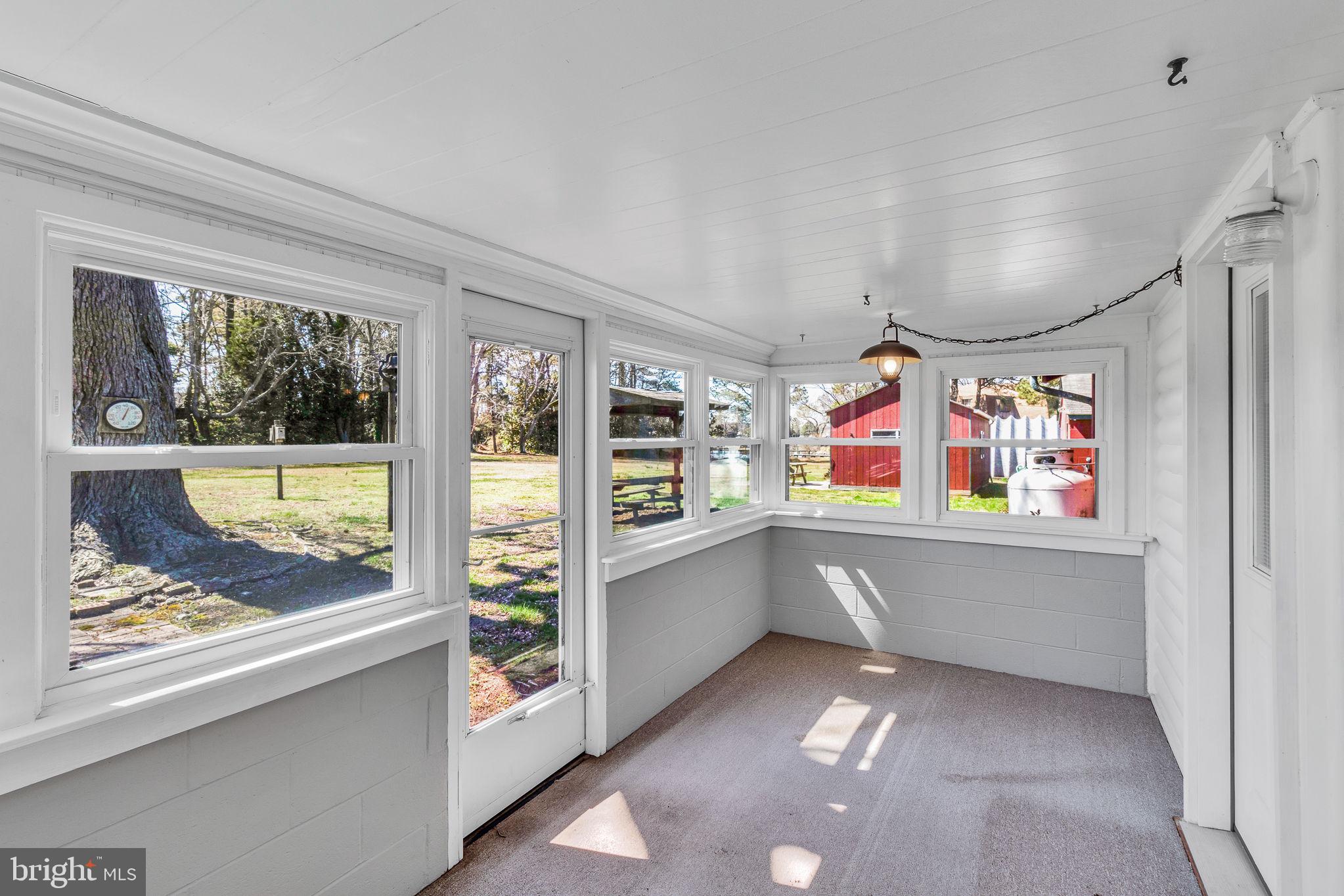 305 Colieville Lane Reedville, VA 22539 - Photo 21 of 49 Bright and airy sunroom retreat.