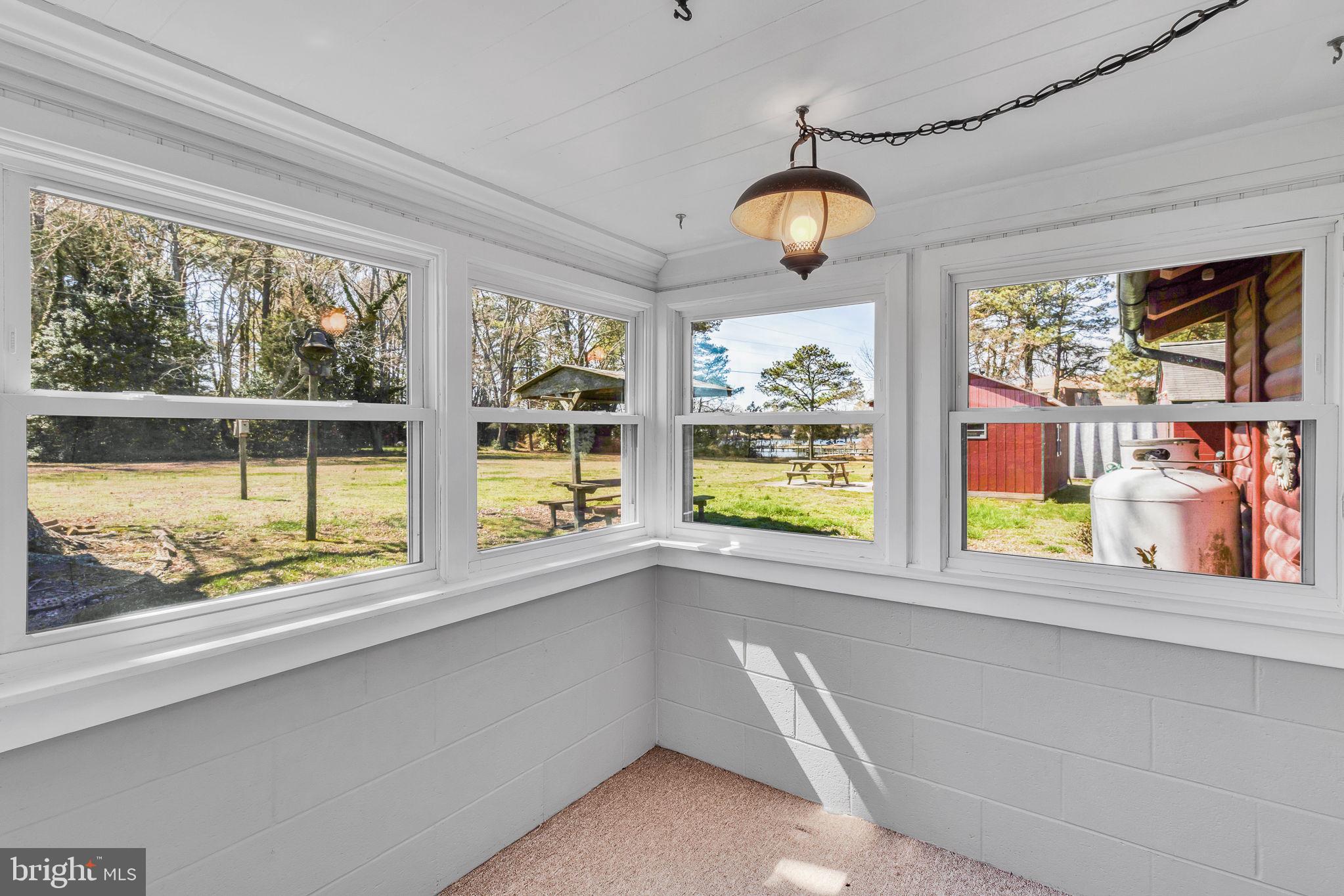 305 Colieville Lane Reedville, VA 22539 - Photo 22 of 49 Bright sunroom with scenic views.