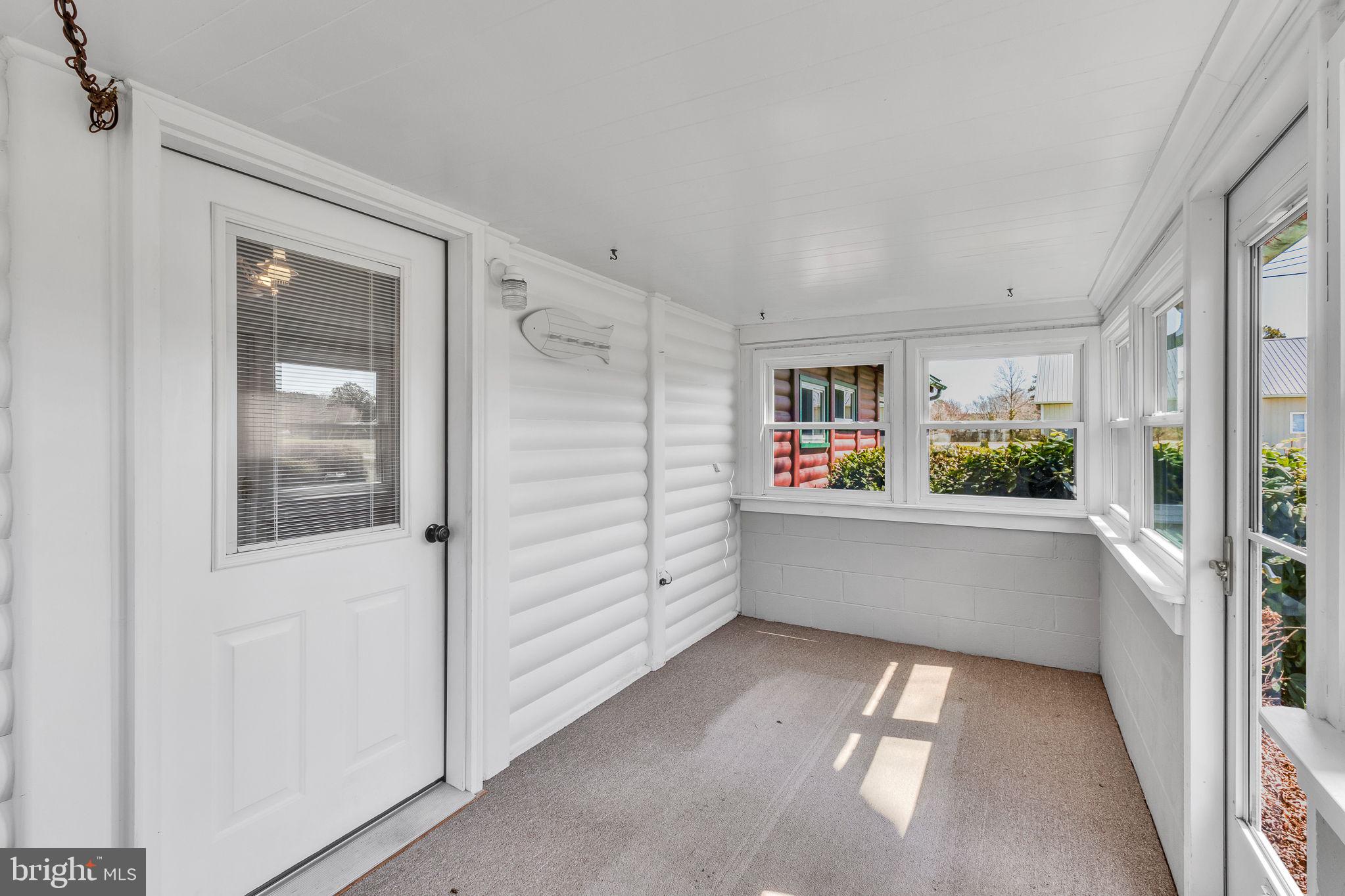 305 Colieville Lane Reedville, VA 22539 - Photo 23 of 49 Bright and airy sunroom retreat.