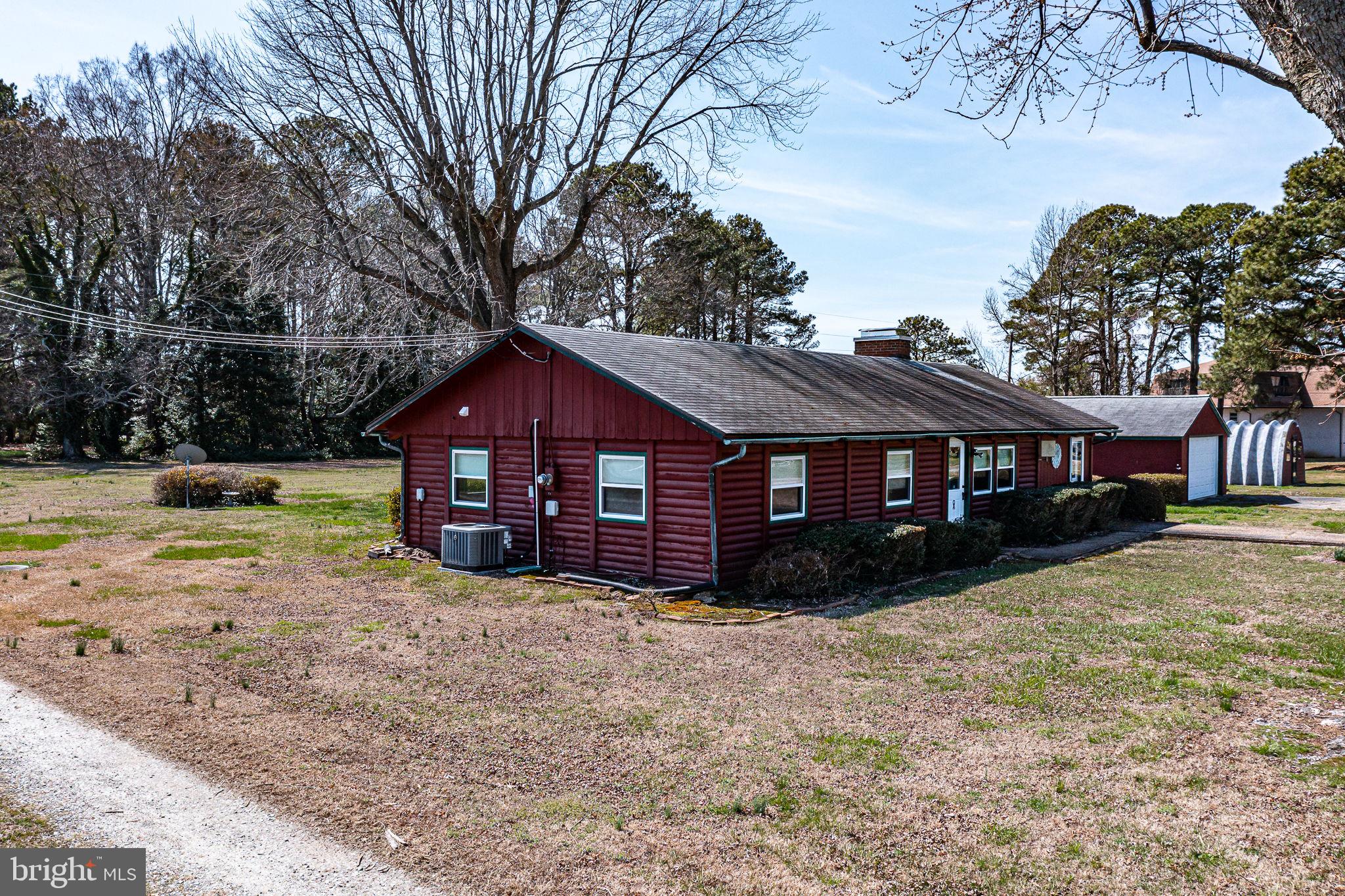 305 Colieville Lane Reedville, VA 22539 - Photo 32 of 49 Charming red cottage on spacious grounds.