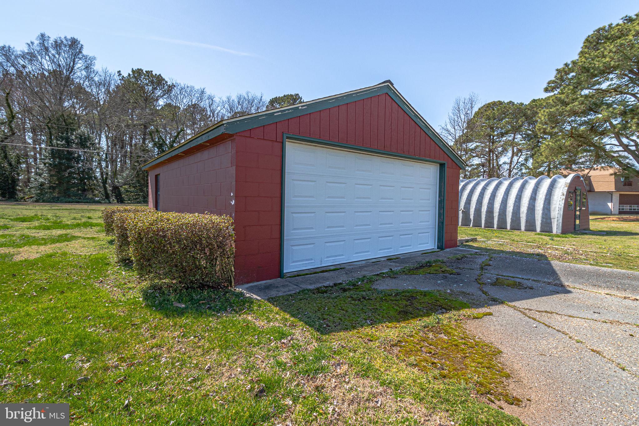 305 Colieville Lane Reedville, VA 22539 - Photo 42 of 49 Charming garage with lush surroundings.