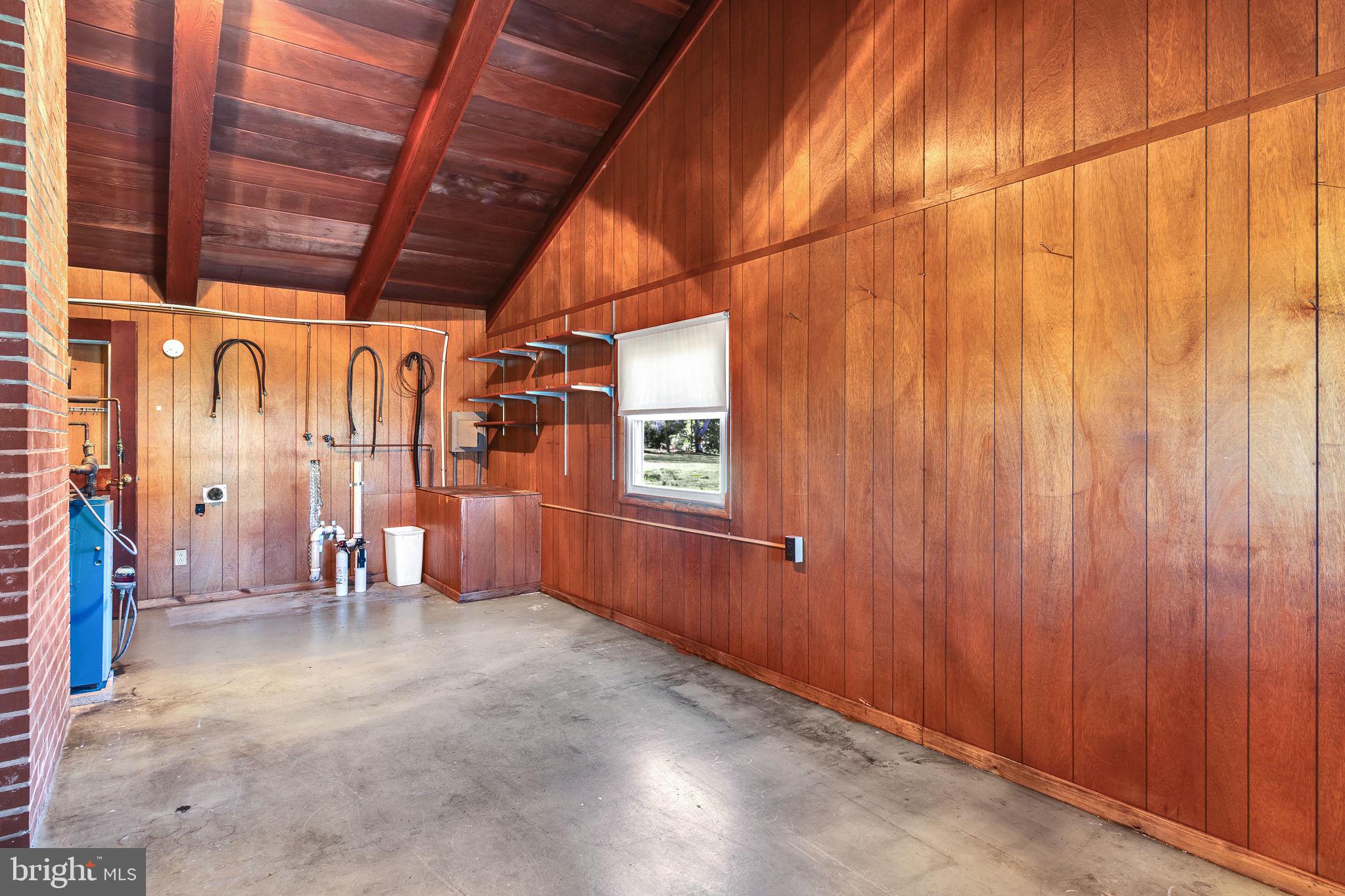 305 Colieville Lane Reedville, VA 22539 - Photo 10 of 49 Spacious room with warm wood accents.