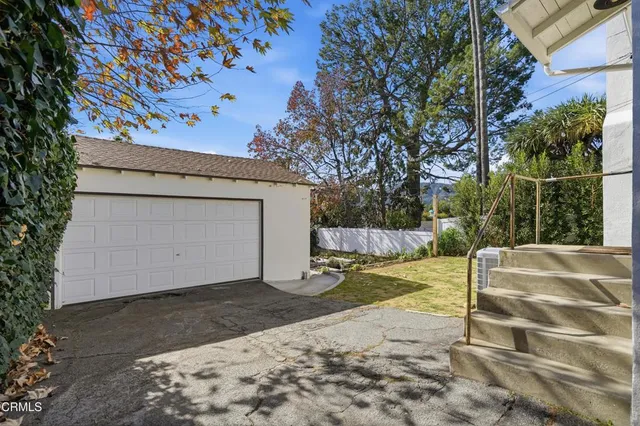 a view of backyard with tub