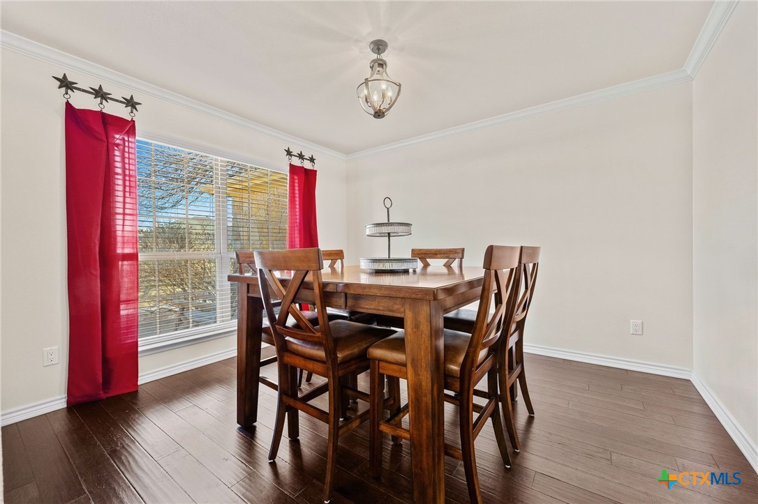 957 County Road 3350 Kempner, TX 76539 - Photo 14 of 35 a view of a dining room with furniture window and wooden floor