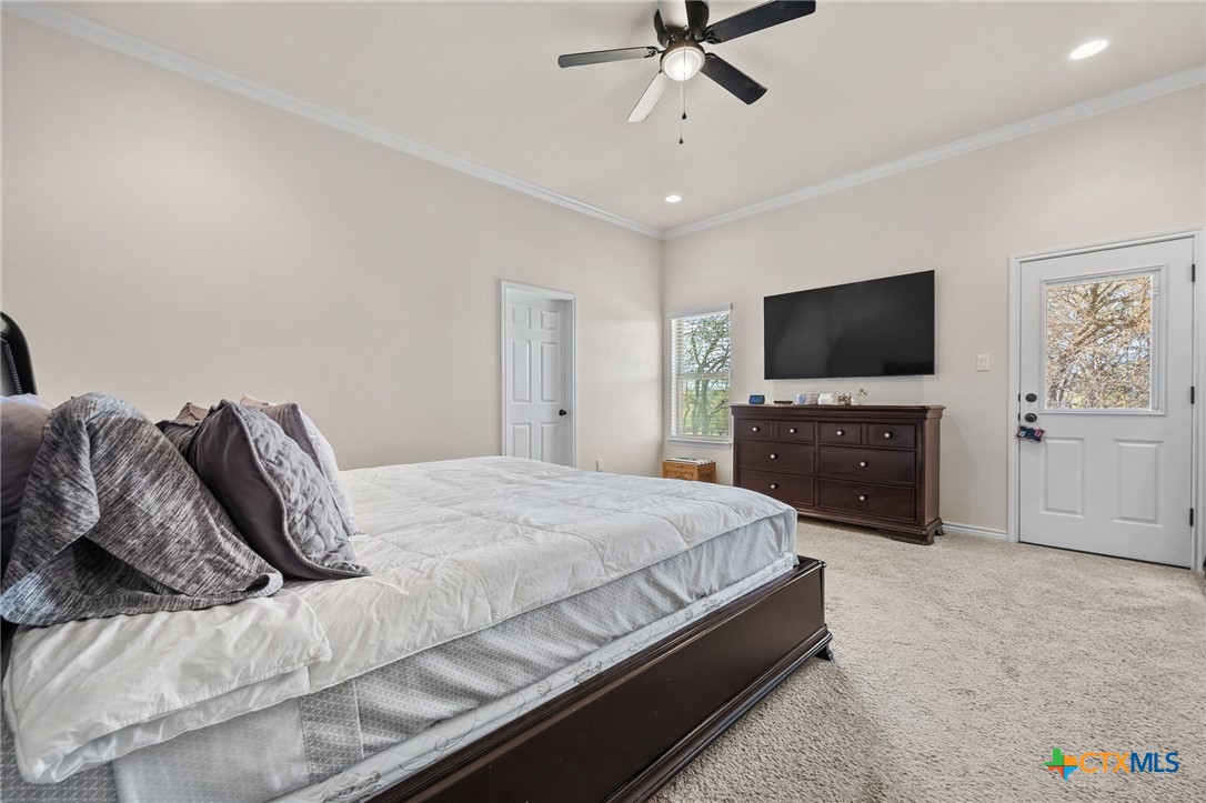 957 County Road 3350 Kempner, TX 76539 - Photo 17 of 35 a bedroom with a bed and a flat screen tv