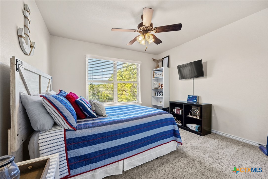 957 County Road 3350 Kempner, TX 76539 - Photo 21 of 35 a bedroom with a bed and a flat screen tv