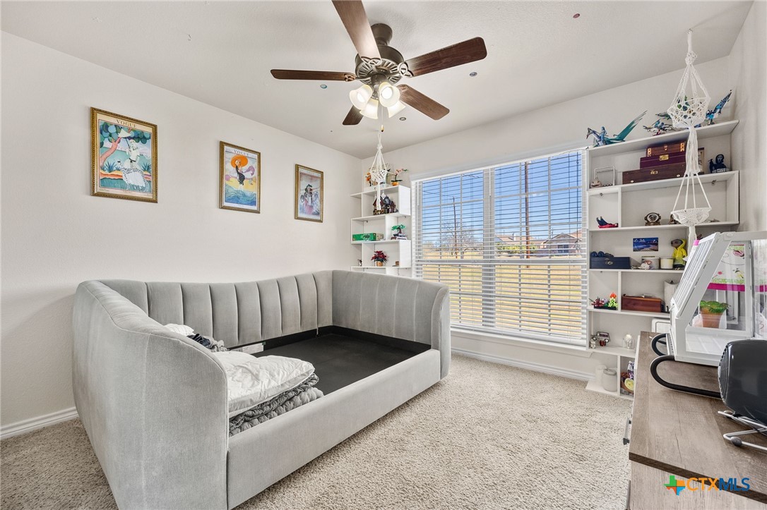 957 County Road 3350 Kempner, TX 76539 - Photo 23 of 35 a living room with furniture and a book shelf