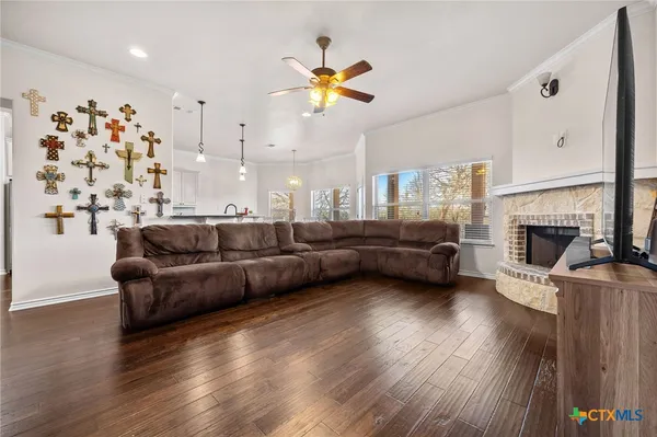 a living room with furniture and a fireplace