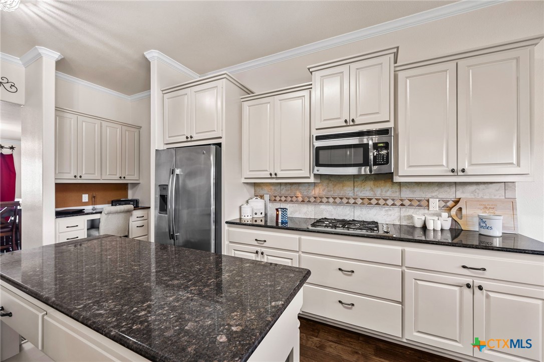 957 County Road 3350 Kempner, TX 76539 - Photo 7 of 35 a kitchen with stainless steel appliances granite countertop a sink a stove and cabinets