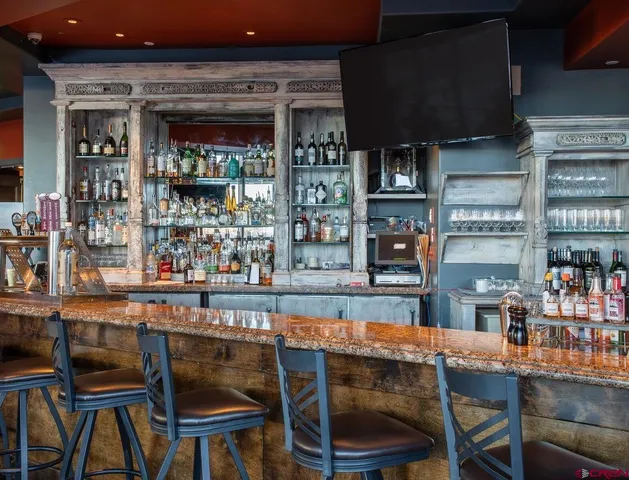 a dining table chair and window in a kitchen
