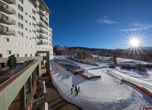 a view of a balcony with chairs