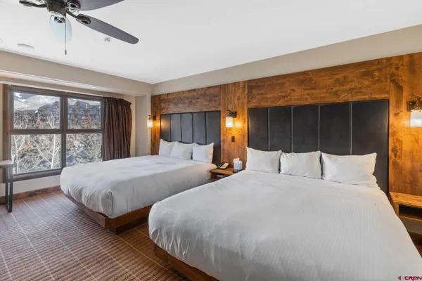 a bedroom with furniture and a window