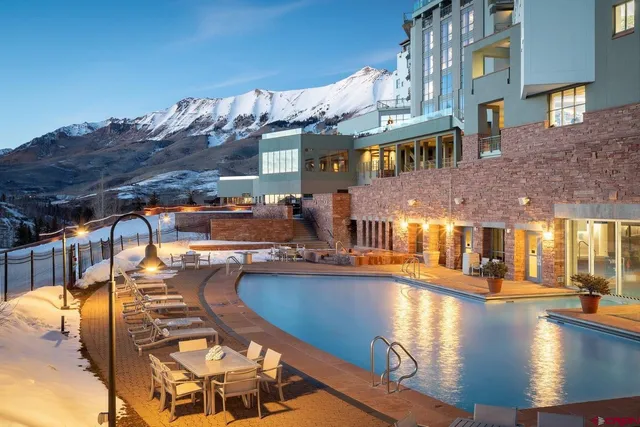 a view of a swimming pool with a lounge chairs